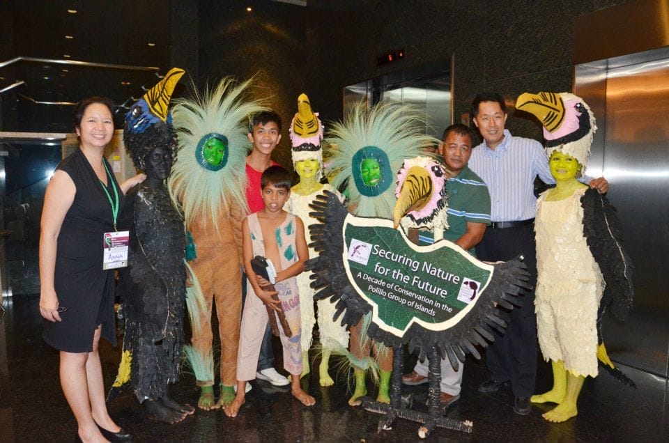 Anna Gonzales and Mike Lu pose with the Tarictic dancers from Polilio Islands.