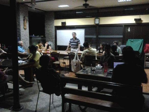 Alex Tiongco leads the discussion about raptor watch and the upcoming Raptor Lecture in August. Photo by Maia Tanedo.