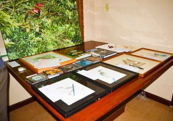 Several framed Hornbill masterpieces in Pen & Ink and a large print by some of our  most talented WBCP members who shared their works of art.  Photo by Marites Falcon. 