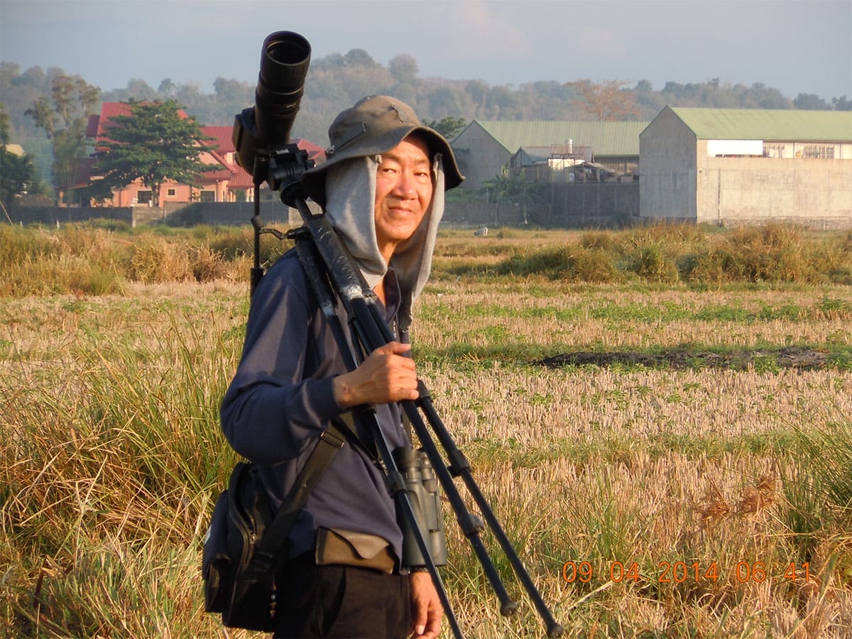 Richard Ruiz strolls through Barangay Lagui's rice fields to look for the Yellow Bunting 